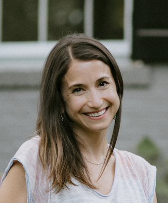 A smiling woman with shoulder-length hair