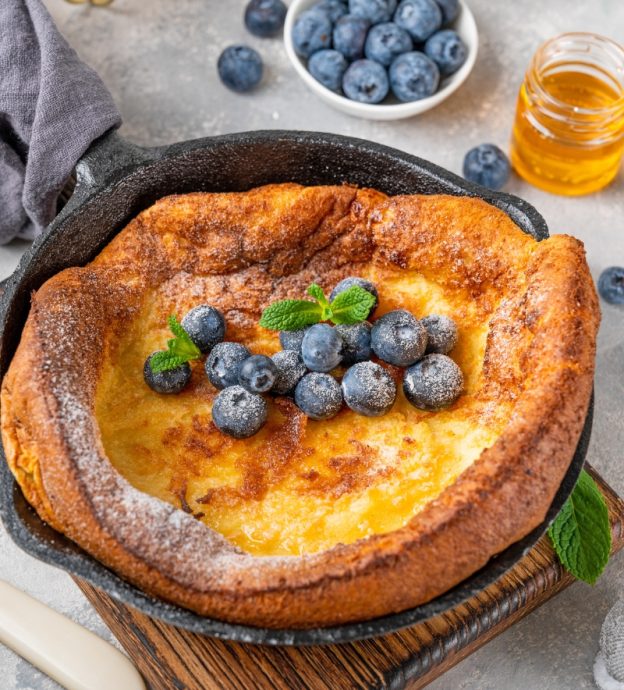 A Dutch baby pancake with fresh blueberries.