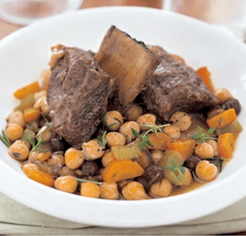 Braised Beef Short Ribs with Spicy Garbanzo Beans in a white bowl