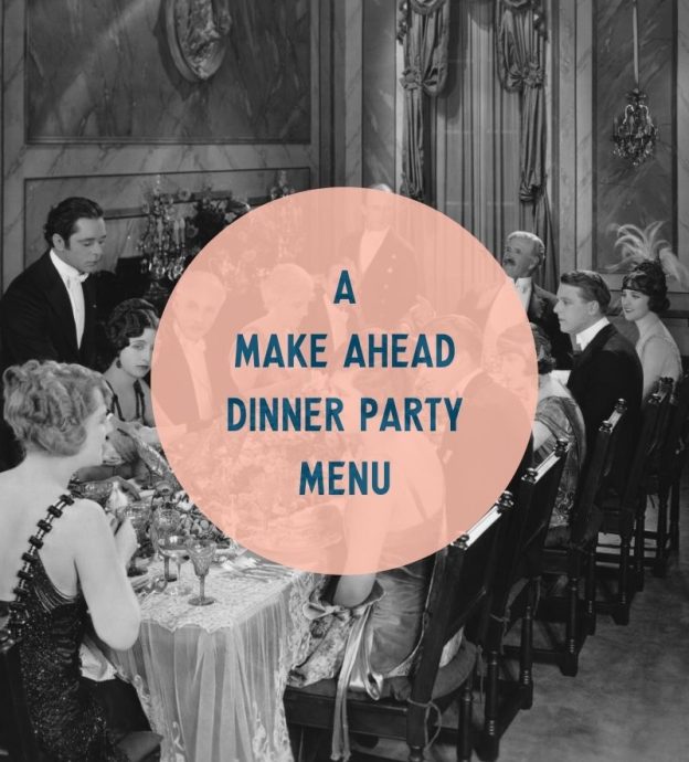 An old-fashioned photo of a group having a dinner party