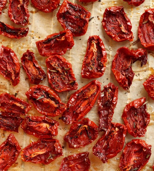 Overhead image of sun-dried tomatoes on parchment
